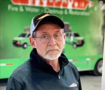 SERVPRO Employee in front of a Compnay Trailer