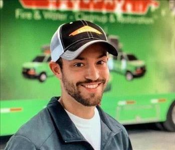 SERVPRO Employee in front of a Compnay Trailer