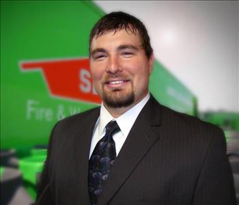 representative in suit w/ SERVPRO background