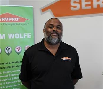 Servpro Project Manager with a Servpro brackdrop