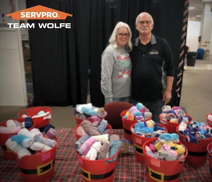 Representatives of SERVPRO donating their time at a charitable Holiday Event